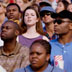 Woman looking for someone in a crowd.